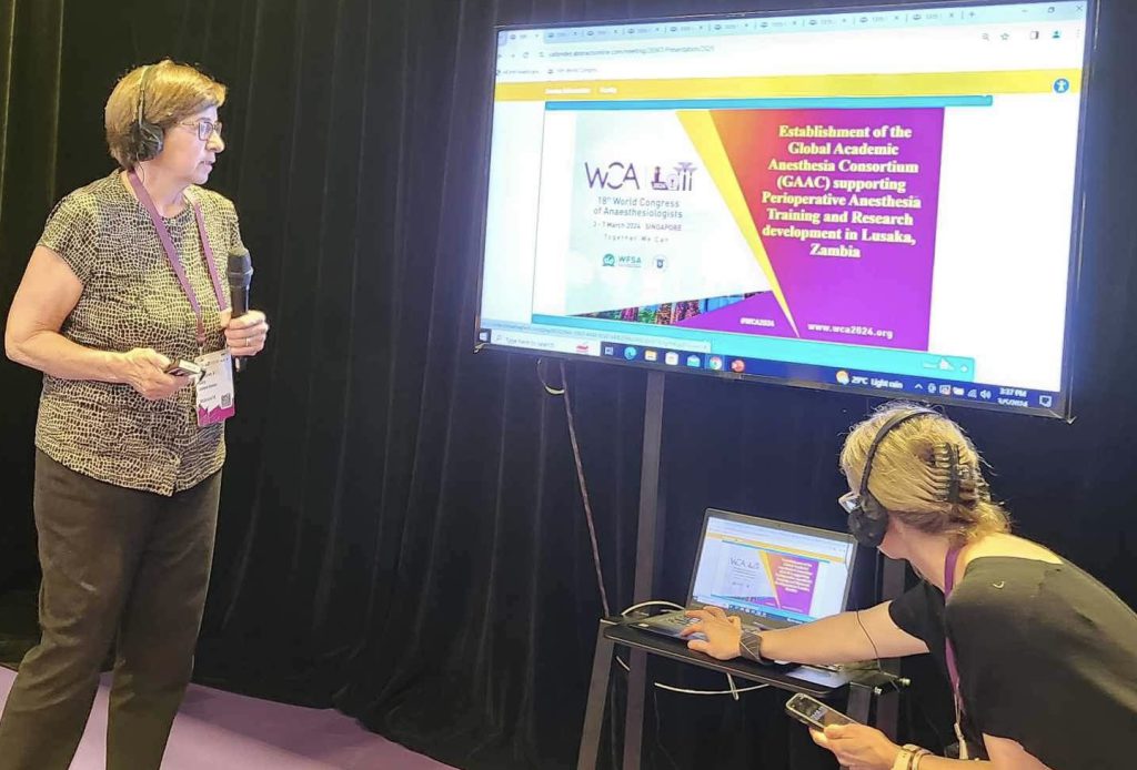 Photo of Dr. Rusy presenting at WCA 2024.