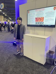 Photo of a presenter in the exhibit hall.