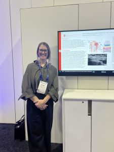 Photo of a presenter in the exhibit hall.