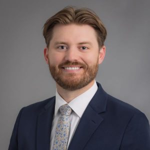 Headshot of Doctor Devin Evavold