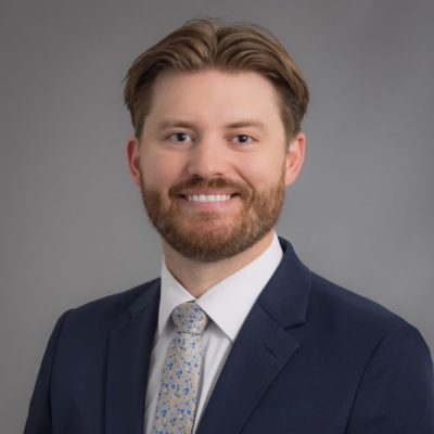 Headshot of Doctor Devin Evavold